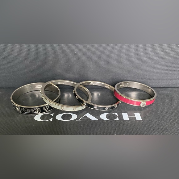 Coach bracelets: 2 black, 1 silver & 1 magenta